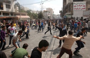 Palestinian protesters throw stones at police attempting to control the streets surrounding the municipality in the southern city of Hebron on 10 September after demonstrators hurled stones at the building  AFP PHOTO / HAZEM BADER