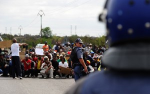 South African police block a march by protesting miners in Rustenburg after a security crackdown in the restive platinum belt  AFP PHOTO / ALEXANDER JOE