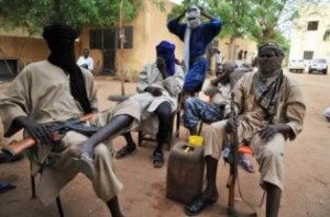 A file picture taken on July 16, 2012 shows fighters of the Islamist group Movement for Oneness and Jihad in West Africa (MUJAO) sitting in the courtyard of the Islamist police station in Gao. (AFP PHOTO)