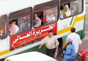 Egyptians ride a public transport bus in Cairo’s populous Attaba district on 9 June 2008. (AFP PHOTO/ CRIS BOURONCLE)