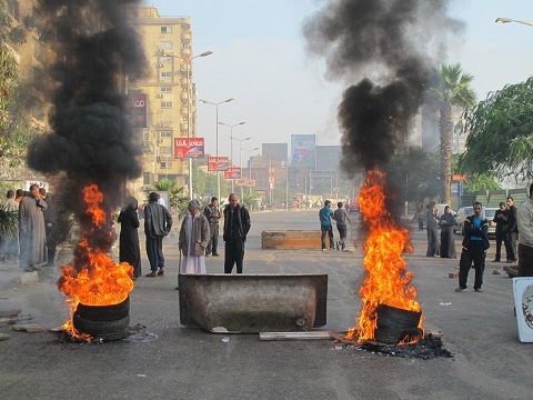 Protesters block Bahr Al-Azam road in Giza, provoking violent confrontations with the security forces last December. (Photo via Mohamed Abla’s Facebook page)