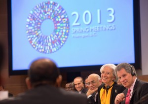 his picture provided by the International Monetary Fund shows IMF Managing Director Christine Lagarde (2nd R) smiles with IMF First Deputy Managing Director David Lipton (R) and IMF Director Masood Ahmed (C) smile at a meeting with members of MENA, Middle East and North Africa, on April 21, 2013 at the IMF Headquarters in Washington during the IMF/World Bank Spring Meetings. (AFP Photo)