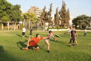  Members of the CAC Ultimate Frisbee Club during the game that involves lots of diving for the Frisbee (Photo from CAC Ultimate Frisbee Club)